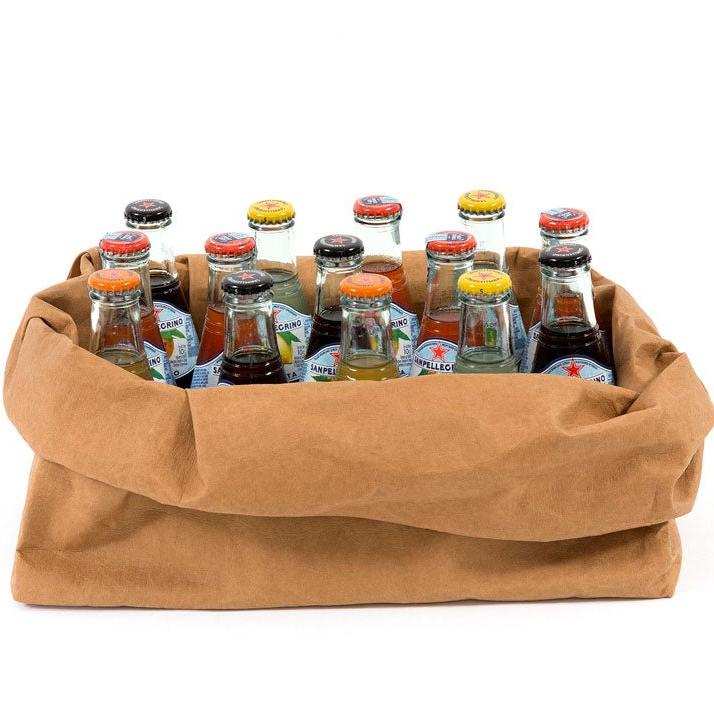 An oblong washable paper tray is shown holding 13 small drinks bottles. The tray is tan in colour.