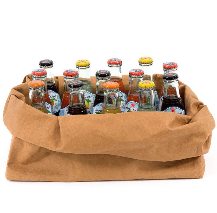 An oblong washable paper tray is shown holding 13 small drinks bottles. The tray is tan in colour.