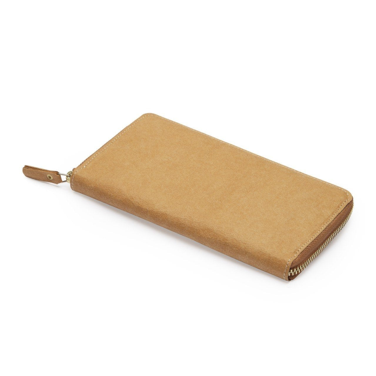 The outside of a large zippered washable paper wallet is shown. The image also shows a silver zip and washable paper zip pull. The wallet shown is tan.