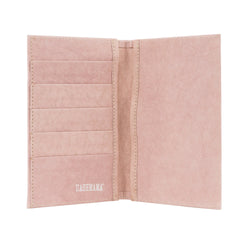 A washable paper large wallet is shown open. On the left hand side are 5 credit card slots. On the right hand side is one large pocket. The UASHMAMA logo is shown on the bottom left of the wallet. The colour of the wallet is pale pink.