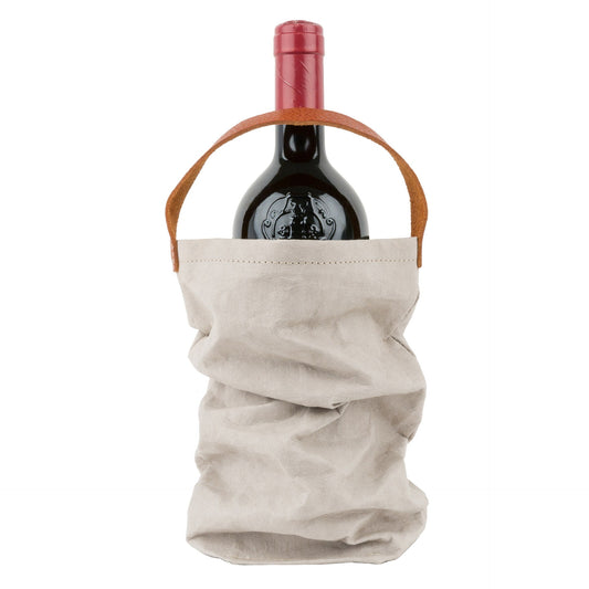 A red wine bottle is shown inside a washable paper wine bag. The bag has a small brown leather handle at the top for carrying. The washable paper wine bag shown is pale grey.